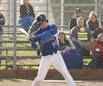 Tahoma’s Jordan Johansen concentrates as the pitch comes at him during a game against Kentwood.