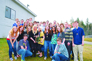 Members of the Tahoma High Speech and Debate team show off their state championship trophy this week.