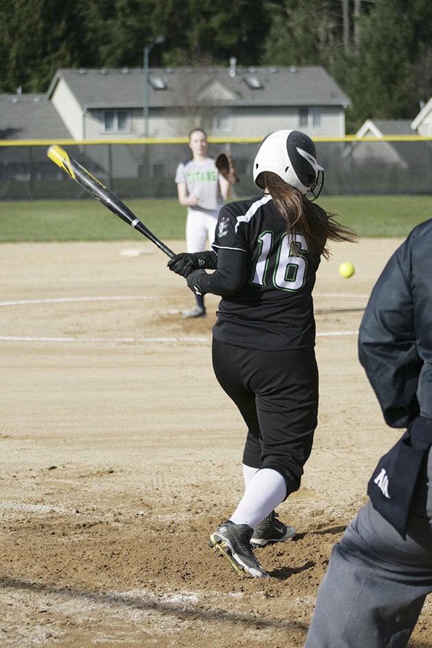 Kentwood softball player makes contact with the ball March 25 at home against Todd Beamer.