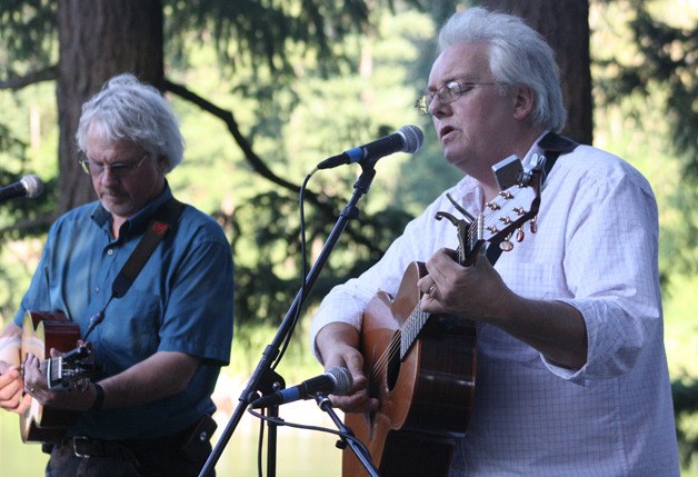 James Keigher on the guitar in the white shirt and Donnie Macdonald from the band Men of Worth performed July 28 at Lake Wilderness Park during the Music in the Park series.