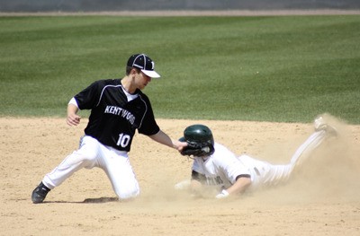 Kentwood shortstop Bryant VanEngelenburg attempts to lay a tag down on Skyline's Connor Gilchrist.