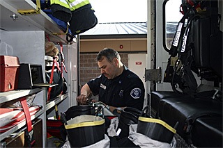 Capt. Phil Herrera checks an oxygen tank Saturday at Station 78 in Covington.