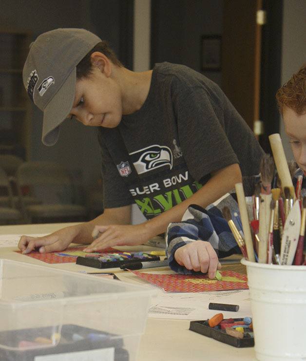 Home-schooled art students met at the Clayopatra art studio in Maple Valley last week to continue their study of an artist from Mexico. The lesson involved drawing with pastels and glazing pottery that the students made the week before.