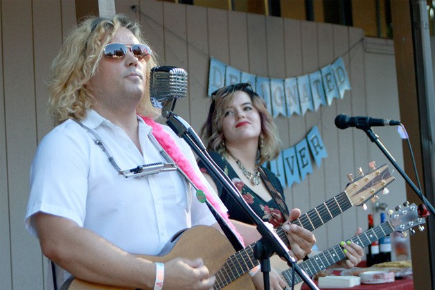 Dace Anderson and Arielle Young of Dace’s Rock ‘N’ More Music Academy perform for the wine-tasting crowd at Maple Valley Rotary’s A Taste of the Valley event.
