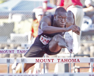 Kentwood's Steve Warner took the 4A state gold crown home Saturday in the 110-meter hurdles at Mount Tahoma Stadium in Tacoma.