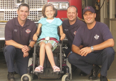 Lindsey Muszkiewicz was adopted by the Maple Valley firefighters as an official firefighter.