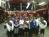 Maple Valley Girl Scout Troop 42887 helped the Jerry Woods Holiday Fire Engine Food Drive this season.