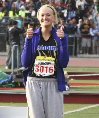 Savannah Johnson gives the thumbs-up sign after reaching 40 feet