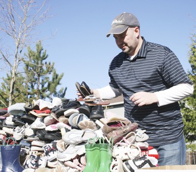 Grant Hayes organized a shoe drive with other dads from the Maple Valley area to help the people affected by the earthquake in Haiti.