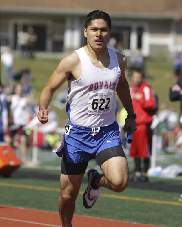 Kent-Meridian junior Edson Zaldivar sprints down the track during a relay race. The Royals boys took fourth out of 45 teams at the Larry Eason Invitational at Snohomish High on April 14.