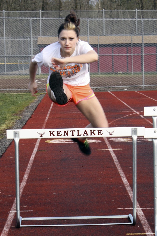Kentlake senior Tori Lanza clears a hurdle during practice Monday afternoon despite a sprained ankle.