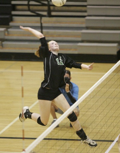 Kentwood’s Erin Campbell swings for the kill in a match against Kentridge that the Conquerors won 3-0.