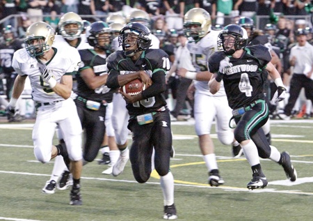 Kentwood's Tristen Askew leads a 57 yard chase for a touchdown in the first quarter last Friday against Auburn.