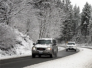 Snow fell Monday morning creating slippery roads for morning commuters. State Route 169 was slick and wet for drivers.