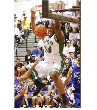 Kentwood’s Joshua Smith throws down a dunk against Federal Way earlier in the season. Smith