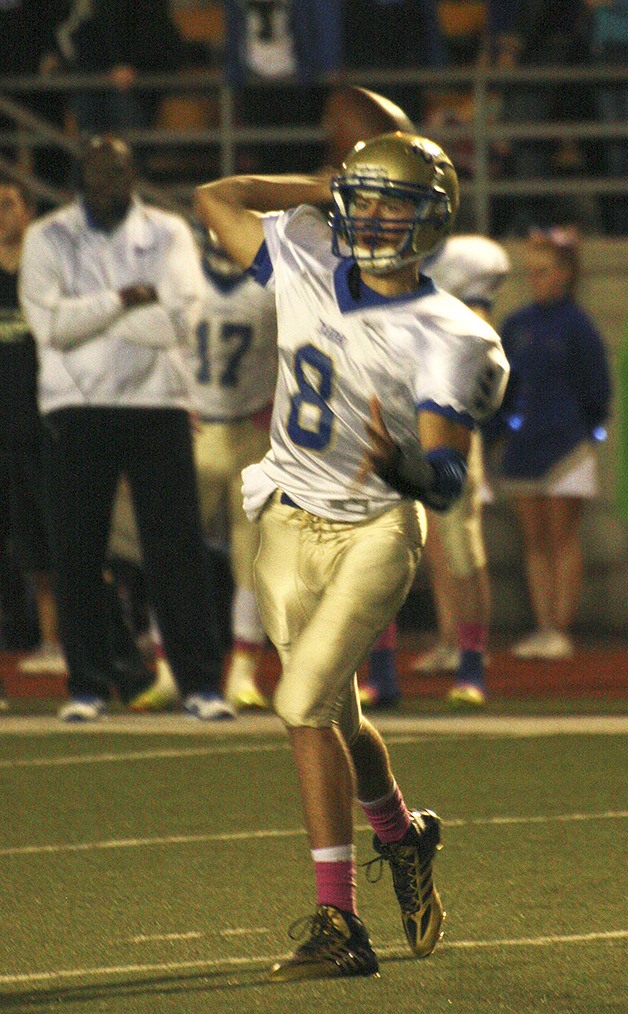 Tahoma’s Shane Nelson looks for a receiver in a 26-14 win over Kentwood Oct. 17 at French Field.