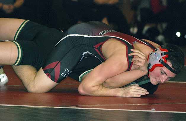 Kentlake's Josh Beckler pins his opponent from Auburn in the 160 pound weight class to end a dual meet between the teams Dec. 18.
