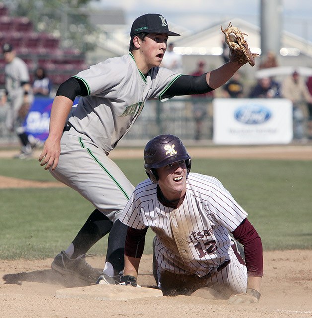 Kentwood’s Mike Ciancio catches the ball before applying the tag to the South Kitsap runner in a 4A state semifinal game May 24 at GESA Park in Pasco. Kentwood took fourth at state.