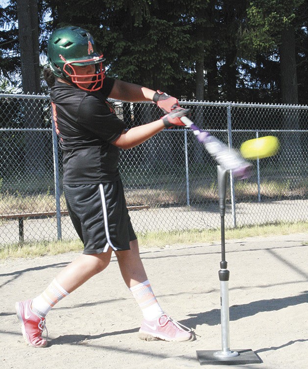 Kaiea Higa practices hitting off the tee at Glacier Park Elementary. Kaiea will compete in the Pitch