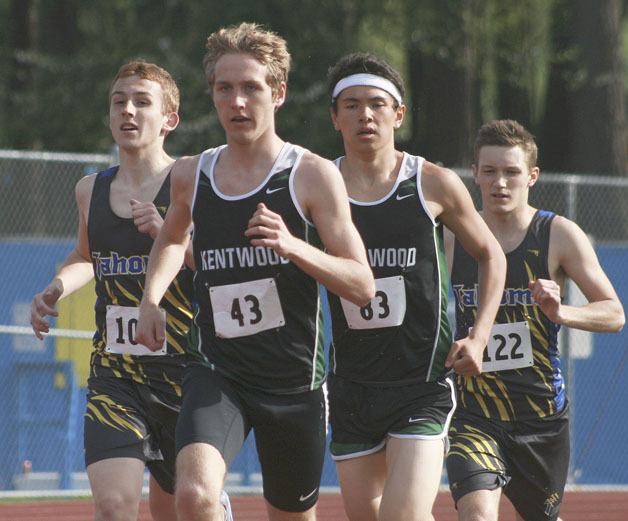 Kentwood senior Danny Lunder leads in the mile against Tahoma junior Riley Campbell (left)