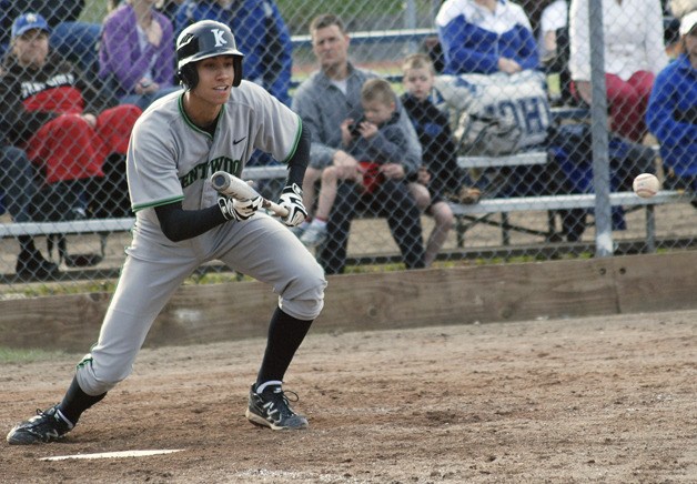 Kentwood senior Taylor Jones lays down a bunt in the top of the seventh inning against Tahoma on Monday. Kentwood held off Tahoma for the 6-5 win to remain undefeated on the season.