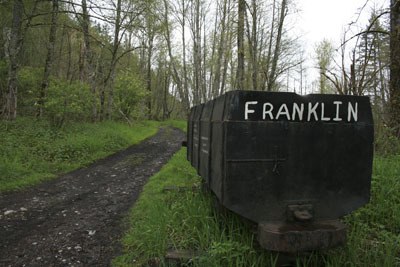 An old mine cart stands where Franklin once stood.