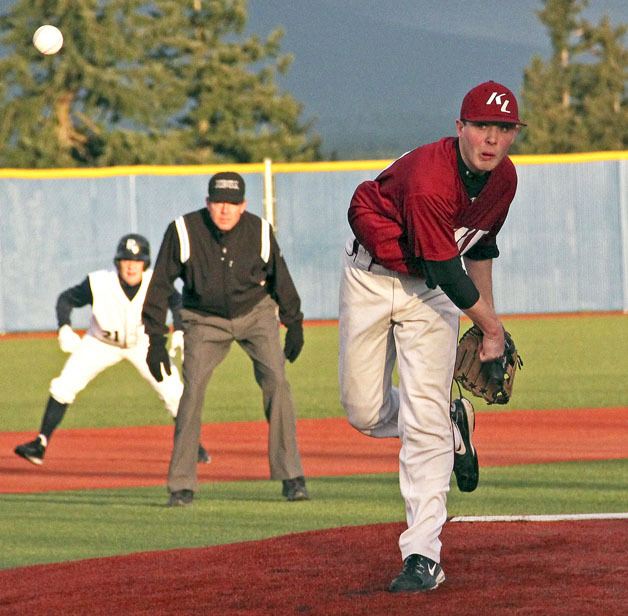 Kentlake’s Dylan Wright hurls the pitch at a batter in a tiebreaker game against Auburn Riverside on Monday. Riverside won the game 10-2 for the fourth seed into league playoffs.