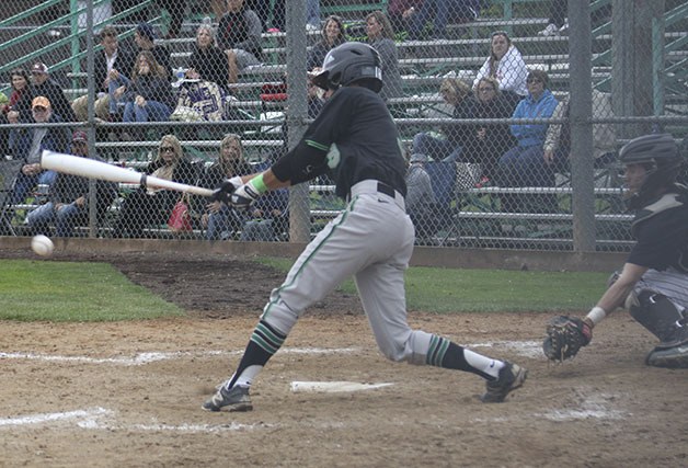 Kentwood junior Isaac Hegamin swings for a pitch during Saturday’s 3-1 loss to South Kitsap.