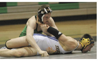 Kentwood High School’s Cody Quinn (top) takes control of Tahoma’s John Buban during last January’s dual meet between the two rival schools. Quinn went on to win the match