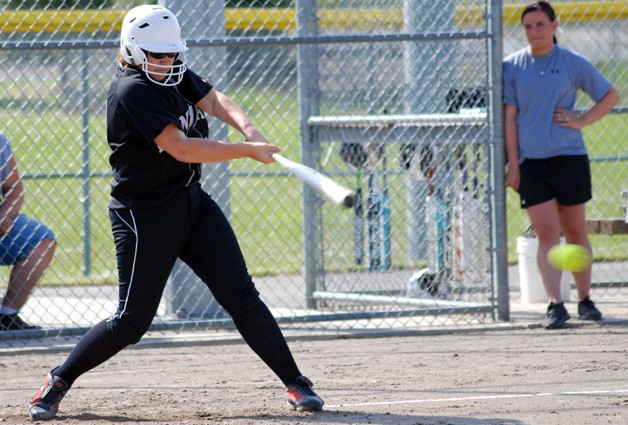Kentlake's Hannah Sauget puts the bat on the ball in a 6-0 win over Kentwood on Monday. Sauget hit a double which drove in two runs to tie the game Tuesday night against Tahoma.