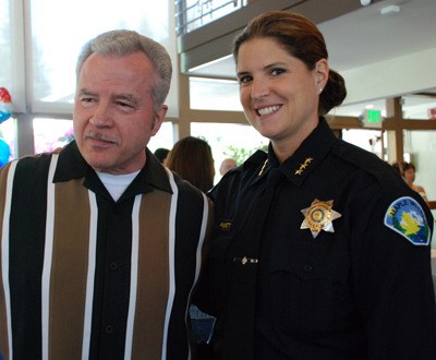 King County Sheriff's Department Maj. Dave Germinai stands with Maple Valley Chief of Police Michelle Bennett at a retirement luncheon given in his honor Friday at the Lake Wilderness Lodge.