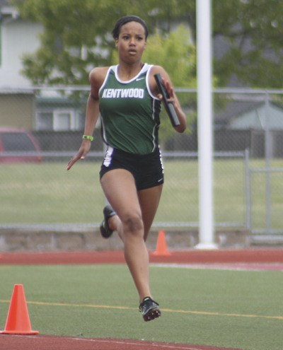 Kentwood senior Madelayne Varela runs the final leg in the 800 meter relay race at the West Central District III track and field meet at Mt. Tahoma in Tacoma.