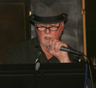 Ed Corrigan reads a poem at the 'War