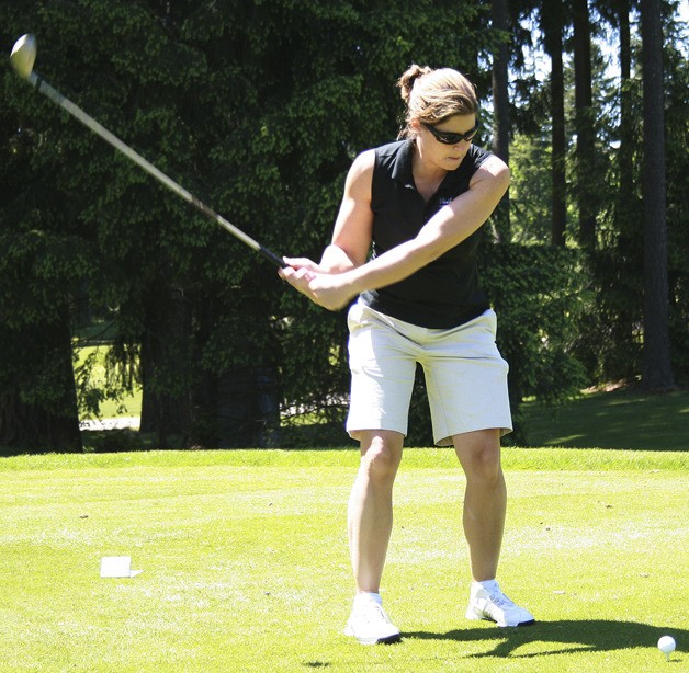 Michelle Bennett mid-swing at the tee during the Maple Valley Rotary Golf Tournament on June 3 at Lake Wilderness Golf Course. Most of the proceeds from the fundraising event will go to the Greater Maple Valley Community Center.