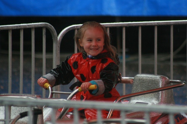 Emma Thomas takes a ride on one of the many attractions at the Maple Valley Days on Friday