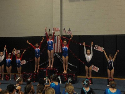 The Summit Gymnastics Trampoline and Tumbling Team competition. (Summit girls are in the red