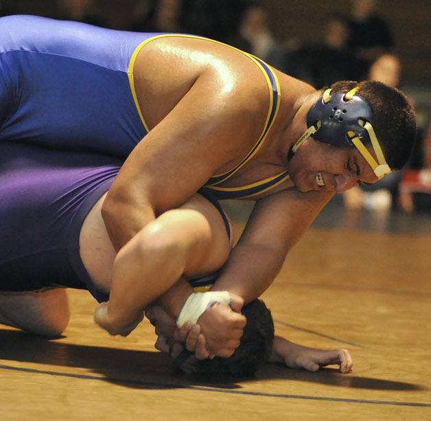 Tahoma's Edwin Torres works to get more points in the 285 pound final against Puyallup's Trent Nivala at the All SPSL Wrestling Tournament Dec. 29 at Auburn High. Torres was Tahoma's lone champion at the event the team won.