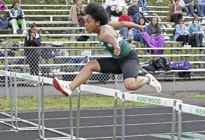 Kentwood’s Aiesha Goodlow sparked the Conquerors’ victory over Kent-Meridian last week by establishing personal bests in the long jump and 100-meters hurdles.