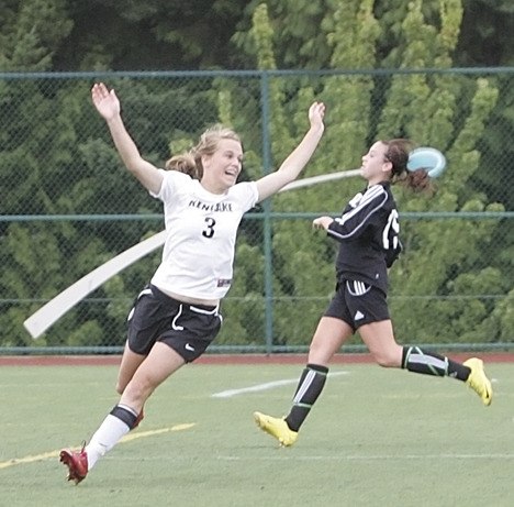 Kentlake’s Callen Shelton celebrates the Falcons’ first goal while Kentwood defender Tori Clark can only watch. Kentlake ended Kentwood’s 41-match unbeaten streak with a 2-1 win.