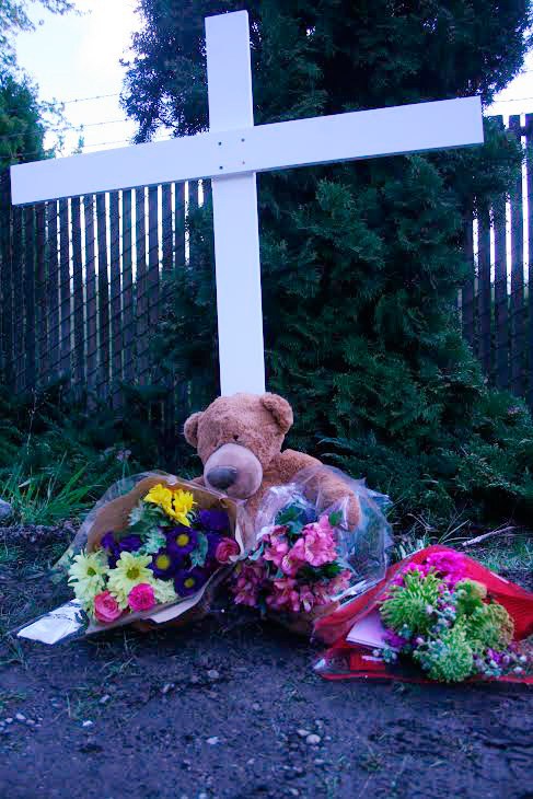 The city of Bonney Lake set up a memorial along Angeline Road where the family of three died Monday.