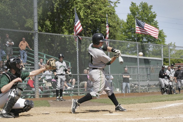 Kentwood's Cash McGuire swings at the game against Edmonds-Woodway on May 19.