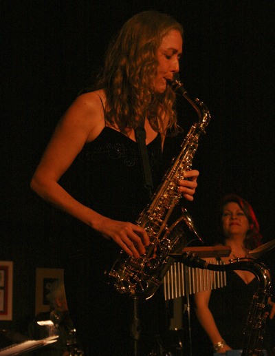Sura Charlier with The Cascade Jazz Quintet plays sax while vocalist Susanna Fuller looks on. The group played Saturday at the Maple Valley Creative Arts Center.