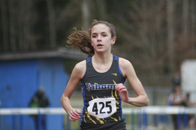 Tahoma freshman Abby Atchison cruises to second place in the two mile during the track meet against Mt. Rainier.