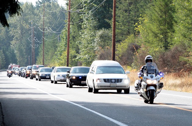 A procession for Cmdr. Greg Goral took place Monday.