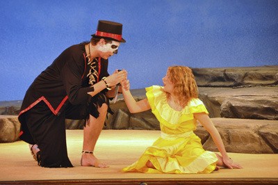 Tahoma drama students Braden DenHerder as Papa Ge and Hannah Fiskum as Ti Moune perform in the school’s latest production