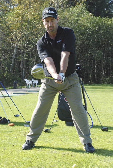 Brad Habenicht of Maple Valley takes practice at the driving range at Druids Glen in preparation for the world long drive finals later this month.