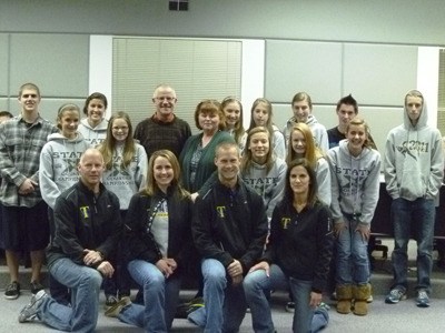The 2011 Tahoma Bears Cross Country Team poses with Mayor Noel Gerken and Deputy Mayor Victoria Laise Jonas. The girls team took first place at the state championship