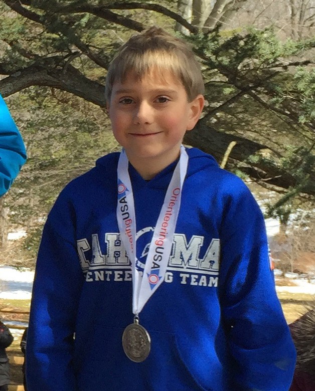 Benjamin Brady stands on the silver podium after placing second at the Interscholastic Orienteering League National Championships in Pennsylvania.