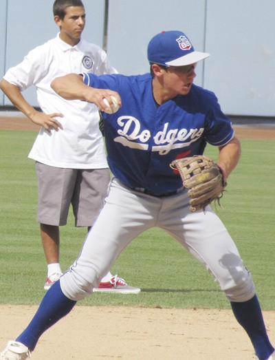 Taylor Smart  works out in the Dodger Stadium infield  Aug. 28 during the Lasorda Elite Games tournament in Los Angeles