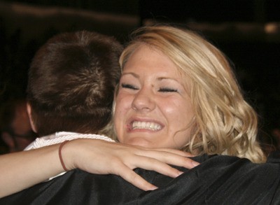 Loriel Jenson hugs Oleg Dovgalyuk following the Kentwood class of 2010 commencement ceremony at the ShoWare Center Saturday evening.